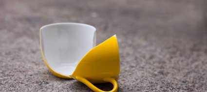 Broken coffee mug on the floor